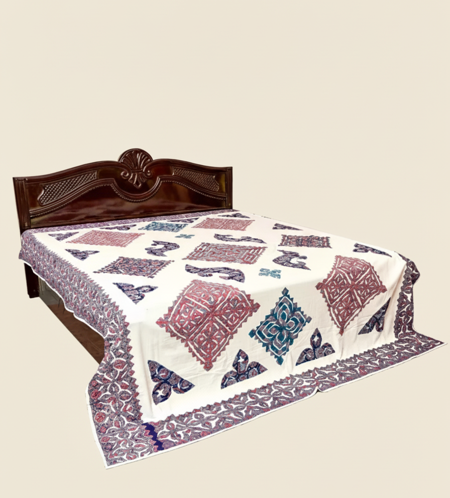 Bed with a patterned bedspread
