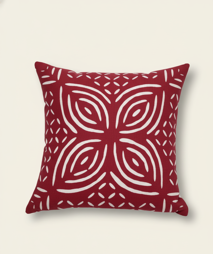 Red pillow with white geometric pattern
