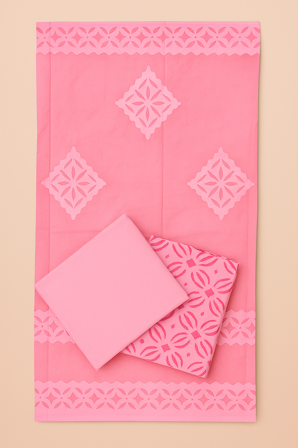 Pink fabric set with applique geometric patterns on a beige background
