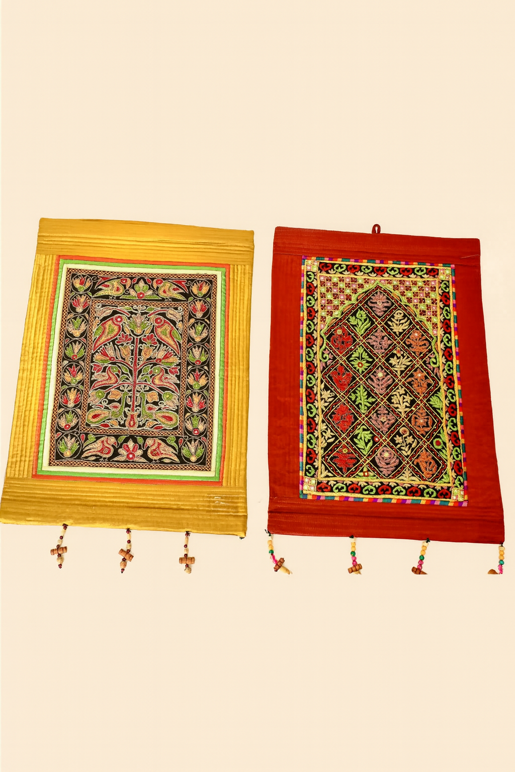Two decorative wall hangings with intricate patterns on a beige background