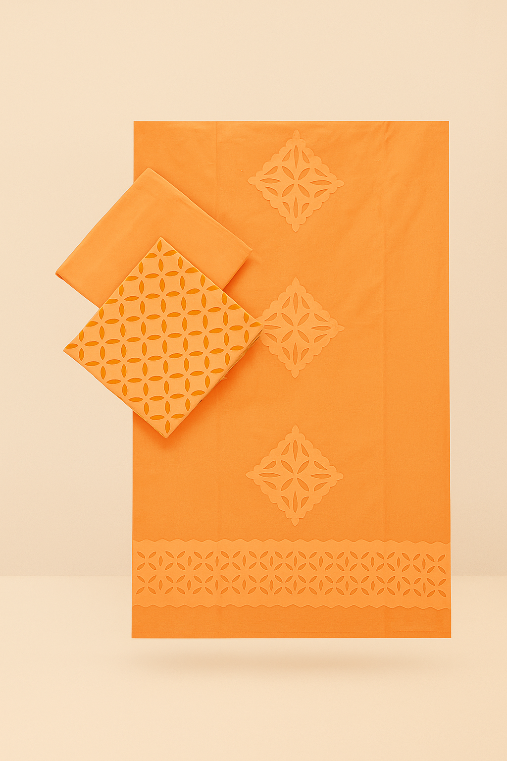 Orange fabric set with applique geometric patterns on a beige background