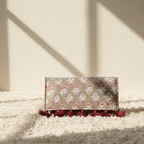 beige floral printed bag on a light background