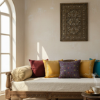 Decorative living room with a wooden sofa, blue embroidered cushion cover, and a wall hanging.