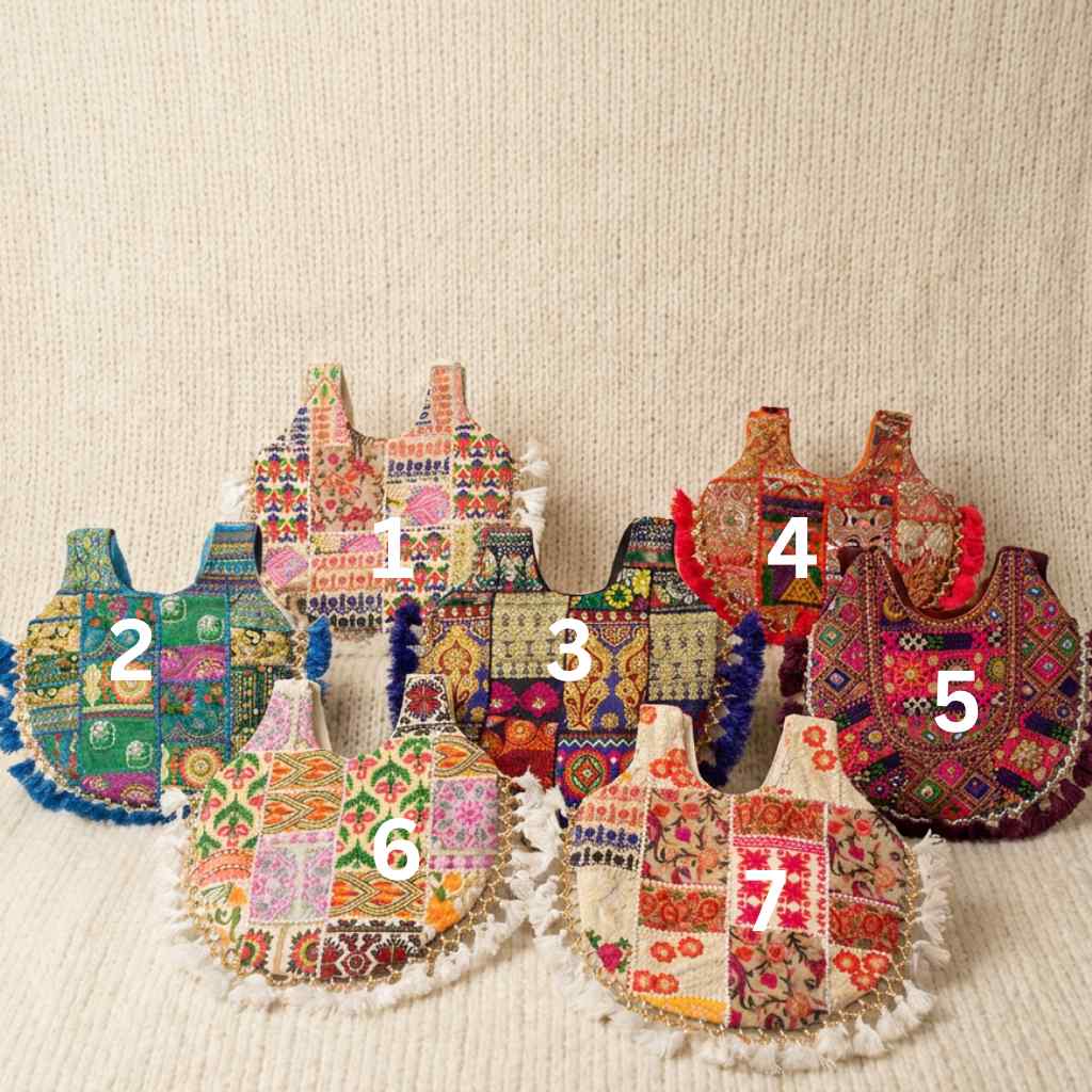 Set of colorful embroidered bags on a beige fabric background