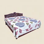 Decorative bedspread with geometric patterns on a beige background