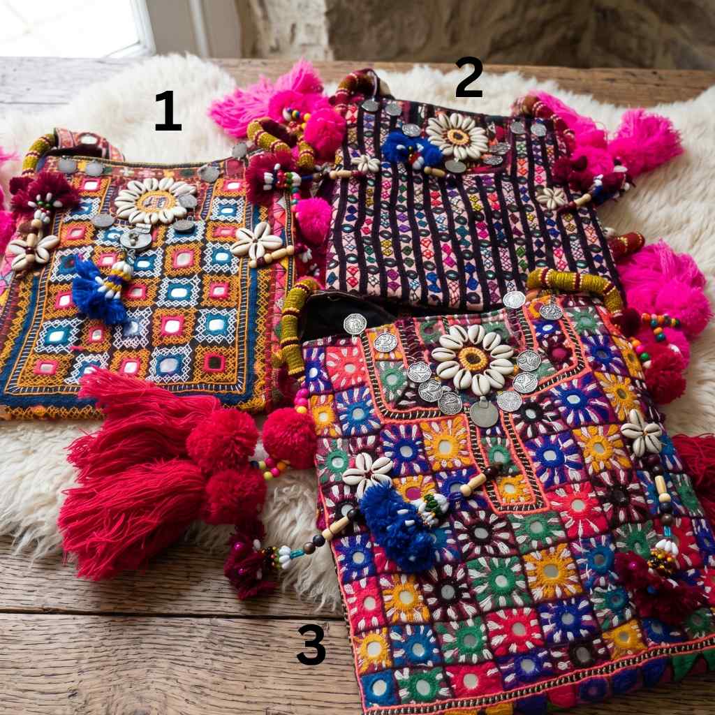 three colorful embroidered bags