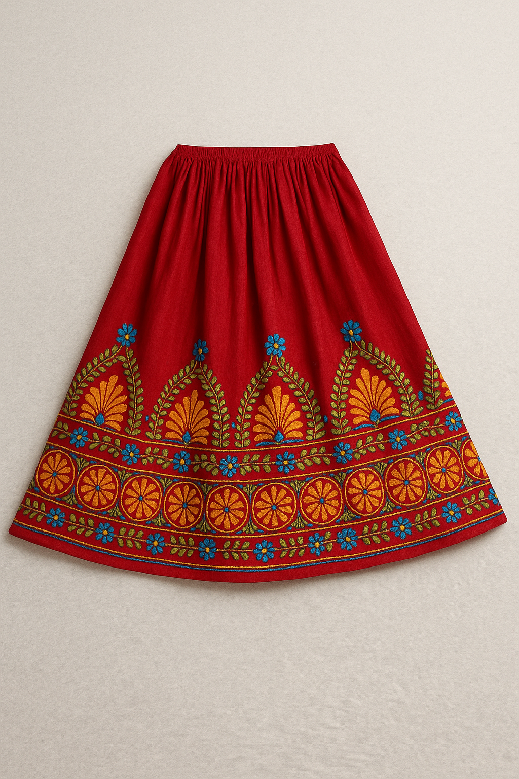 Red skirt with colorful embroidery on a beige background
