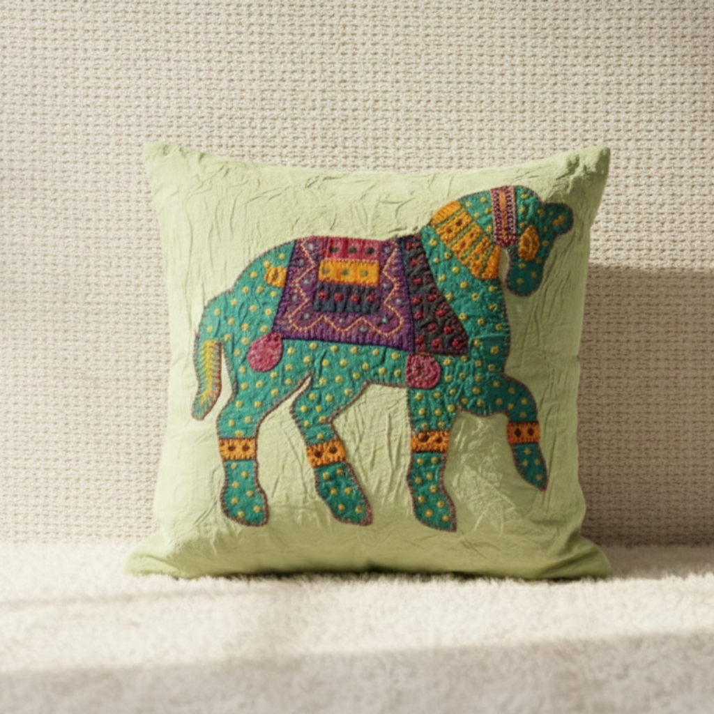 Decorative cushion cover with a colorful camel design on a neutral background