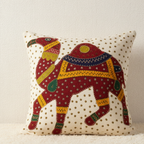 Decorative pillow with a colorful camel design on a beige background