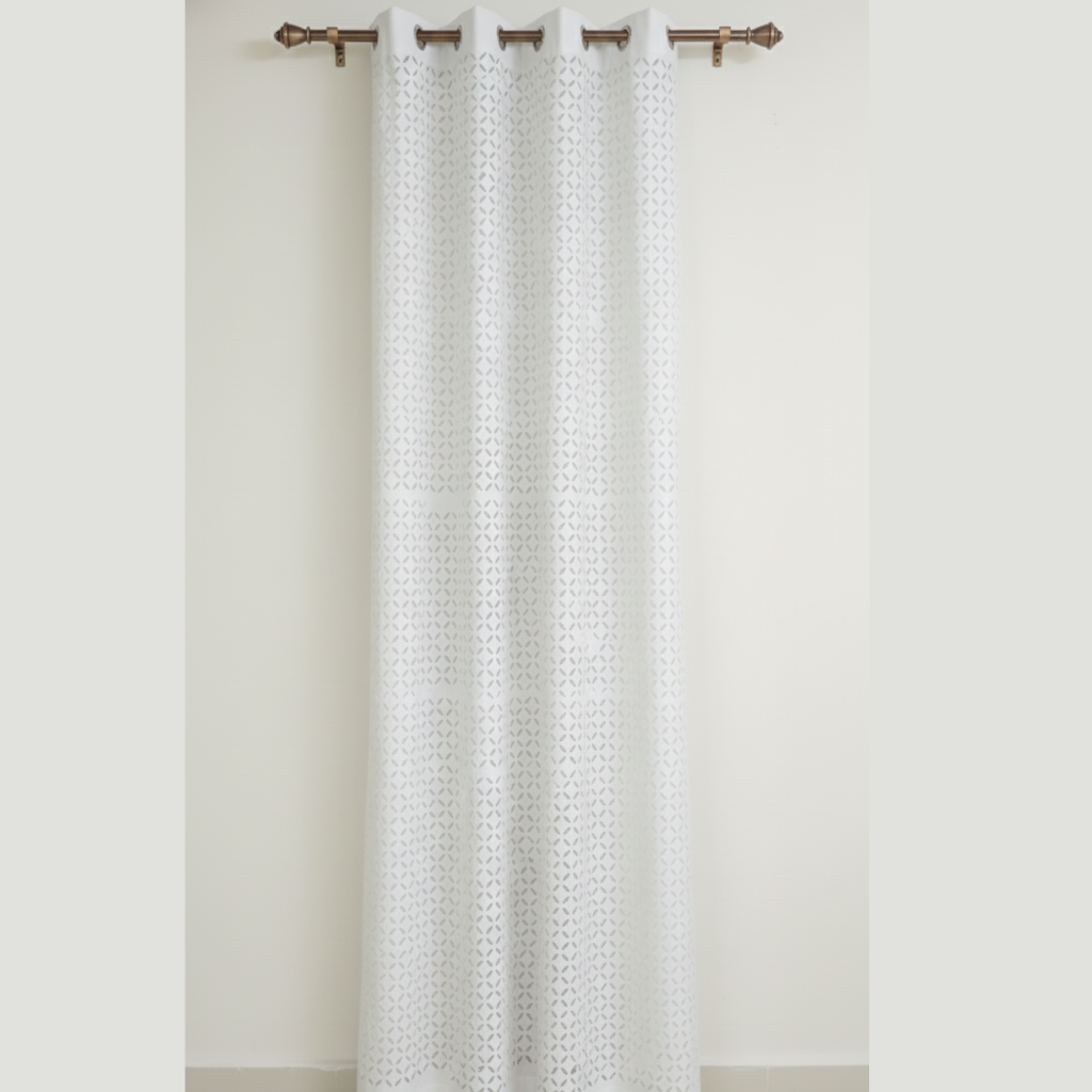 White textured curtain with metallic rings on a white background