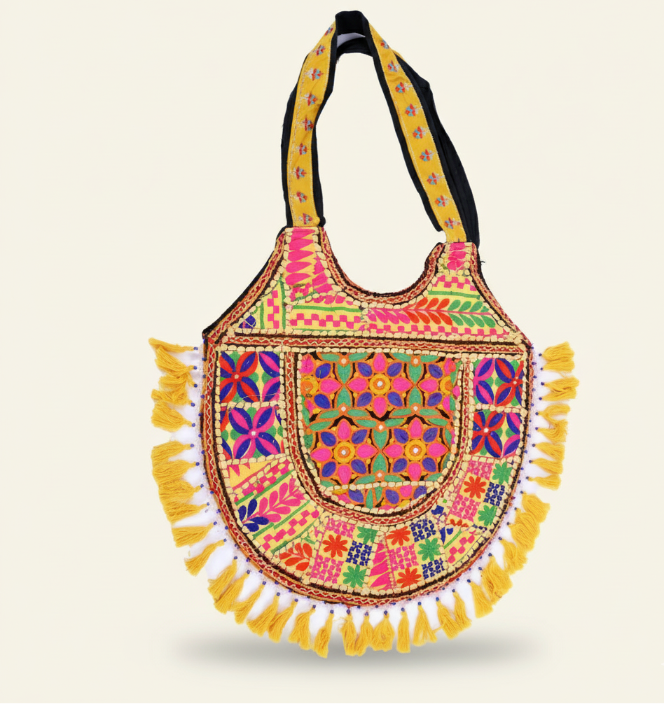 Colorful handbag with intricate patterns and tassels on a beige background
