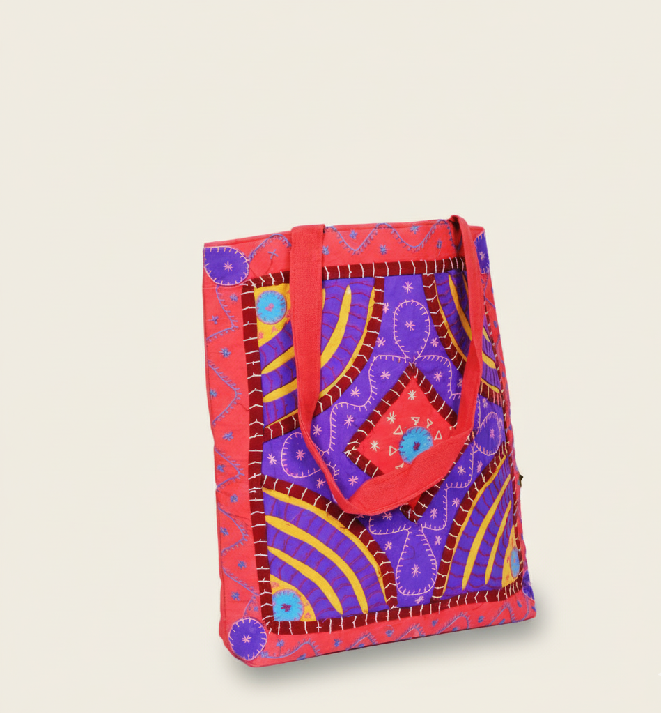 Red and purple patterned bag on a beige background