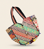 Colorful patchwork bag with intricate patterns on a beige background