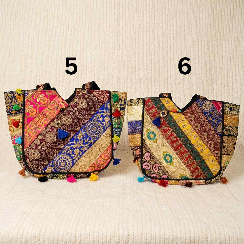 Two colorful zari bags with intricate patterns on a textured beige background