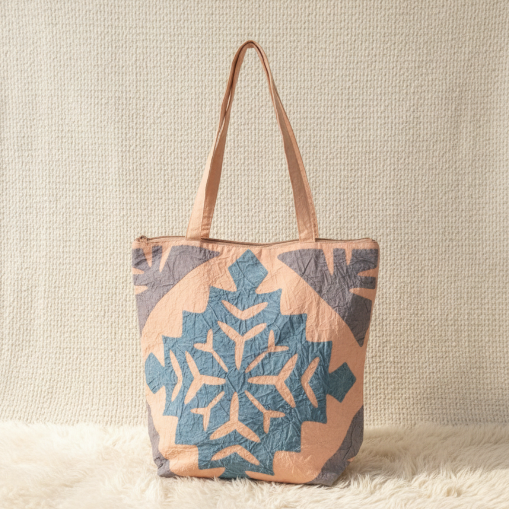 applique Tote bag with geometric pattern on a textured surface