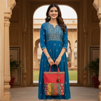 woman in blue attire holding a red patchwork bag