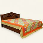 Decorative bedspread with floral pattern on a wooden bed