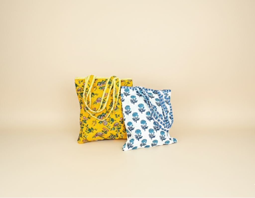 Two fabric bags with floral patterns on a beige background