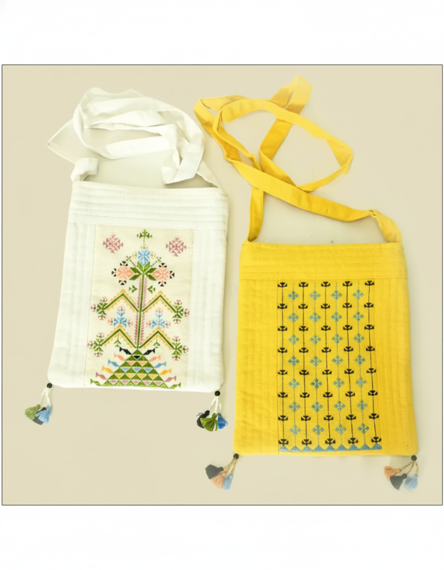 Two bags, one white with floral embroidery and the other yellow with geometric pattern, on a beige background.