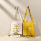 Two bags, one white with embroidery and one yellow with patterns, on a textured beige background.
