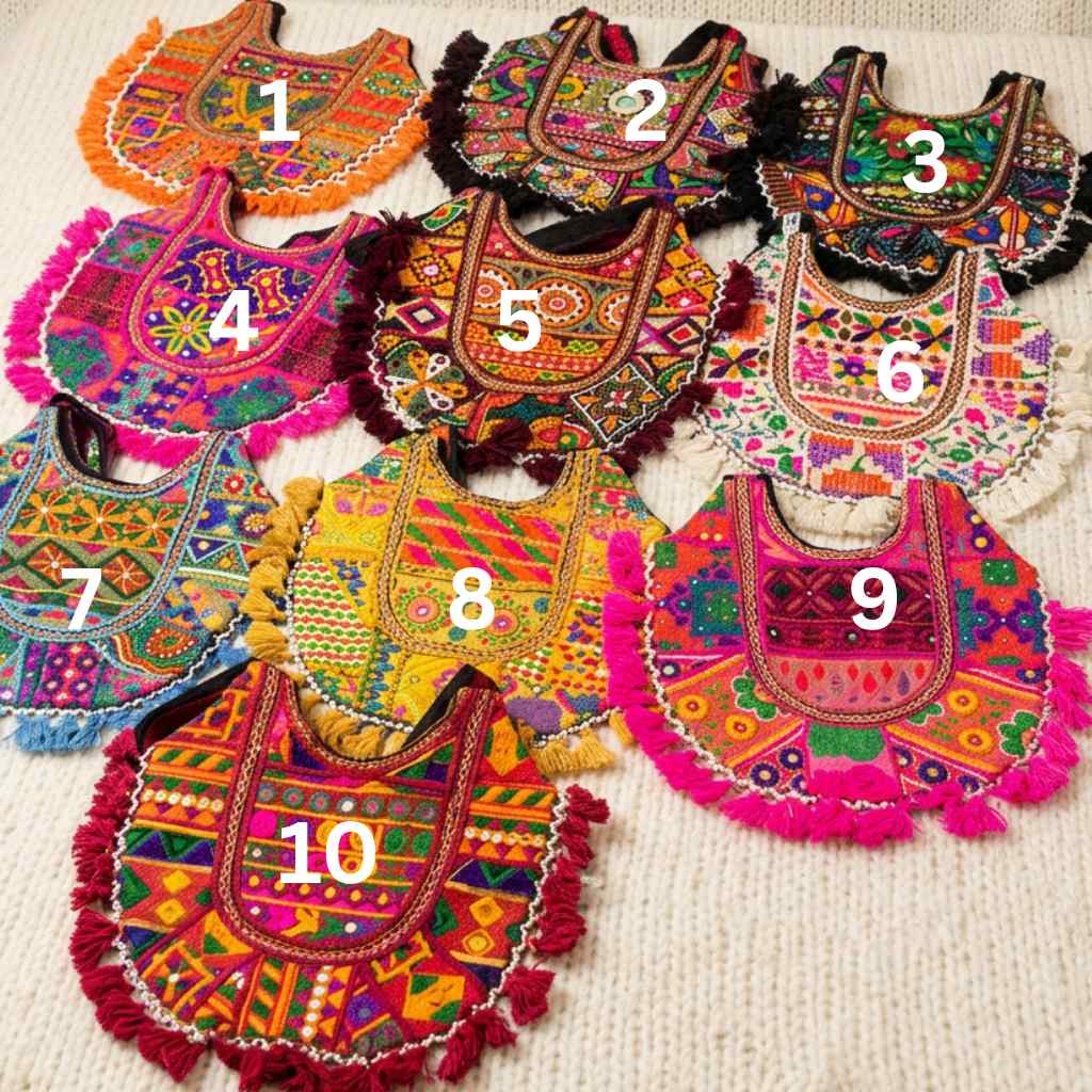 Colorful embroidered bags on a textured surface