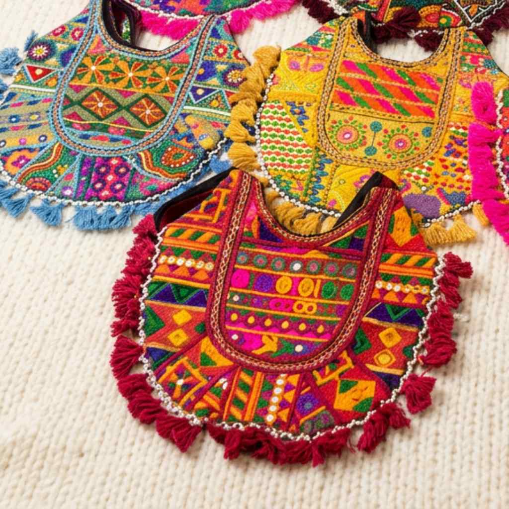 Colorful embroidered bags with intricate patterns on a textured surface