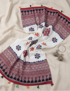 Embroidered fabric with colorful patterns on a beige background