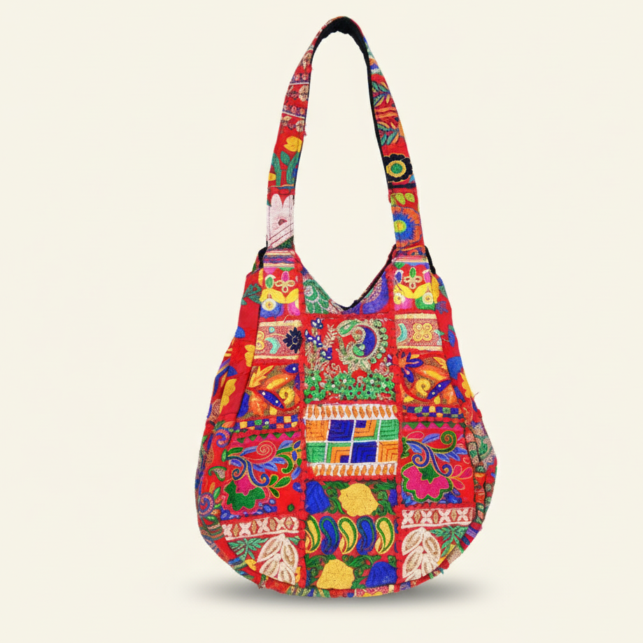Colorful patchwork handbag on a light beige background