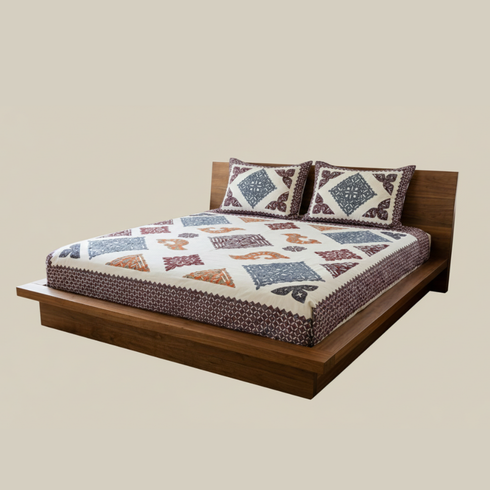 Wooden bed with patterned bedding and pillows on a beige background