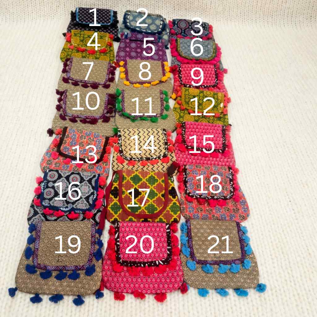 Colorful ajrakh bags with numbers on a beige background