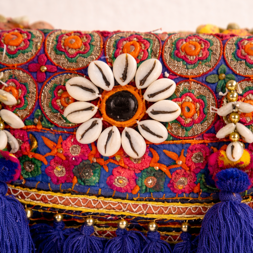 Colorful embroidered bag with cowrie shells and tassels
