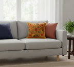 Gray sofa with yellow embroidered cushion in a living room setting