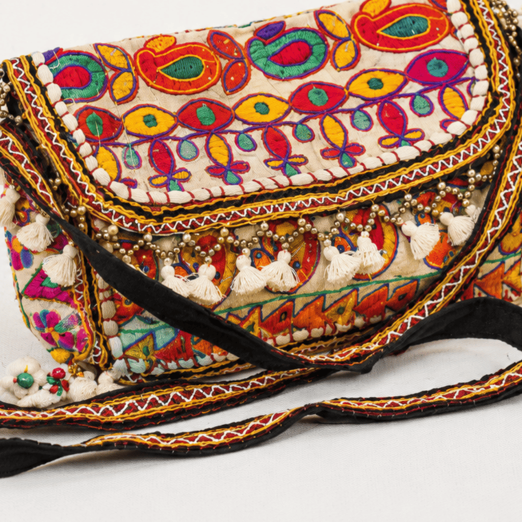 close up of white Nomad Banjara Embroidered Sling Purse