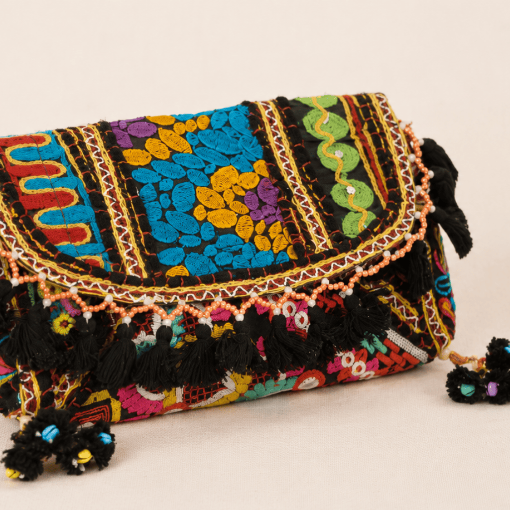 a black Nomad Banjara Embroidered Sling Purse