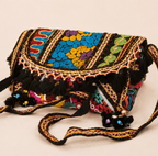 a black Nomad Banjara Embroidered Sling Purse