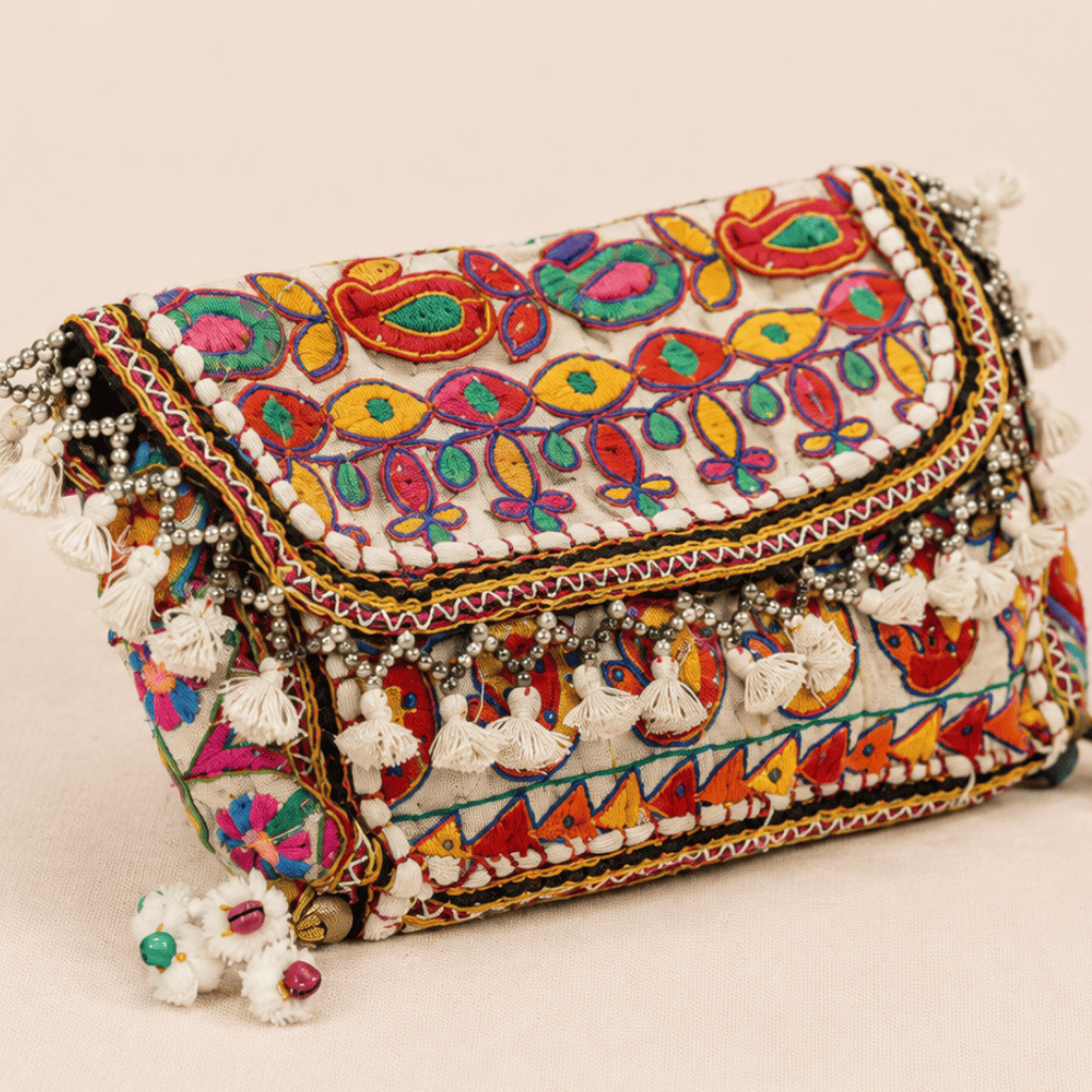 a white Nomad Banjara Embroidered Sling Purse