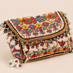 a white Nomad Banjara Embroidered Sling Purse
