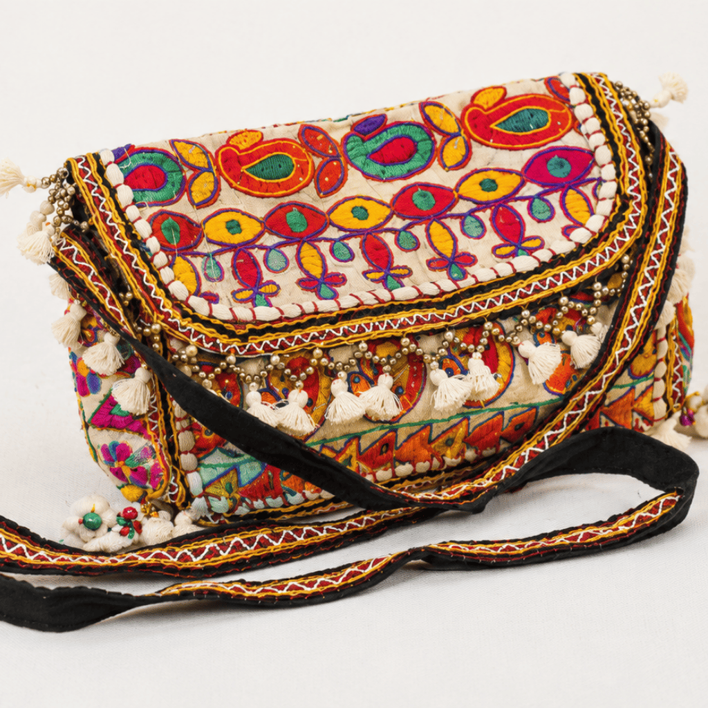 a white Nomad Banjara Embroidered Sling Purse