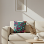 Beige sofa with a colorful patterned pillow in a living room setting