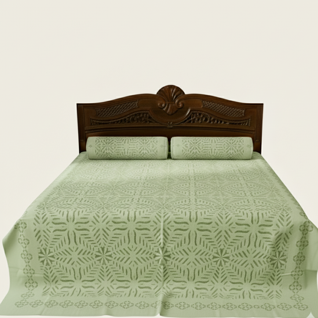 Bed with green floral-patterned cover and wooden headboard on a beige background