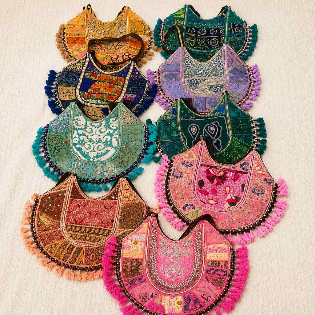 Colorful embroidered bags with tassels on a light background