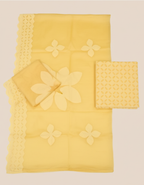 Yellow fabric set with floral patterns on a beige background