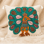 Decorative cushion cover with peacock design on a textured surface