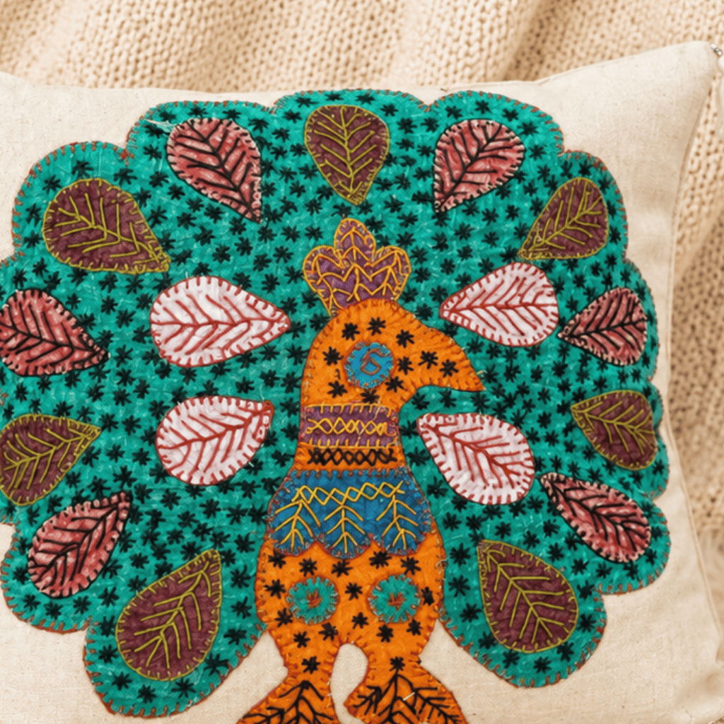 Decorative pillow with a colorful peacock design on a beige background
