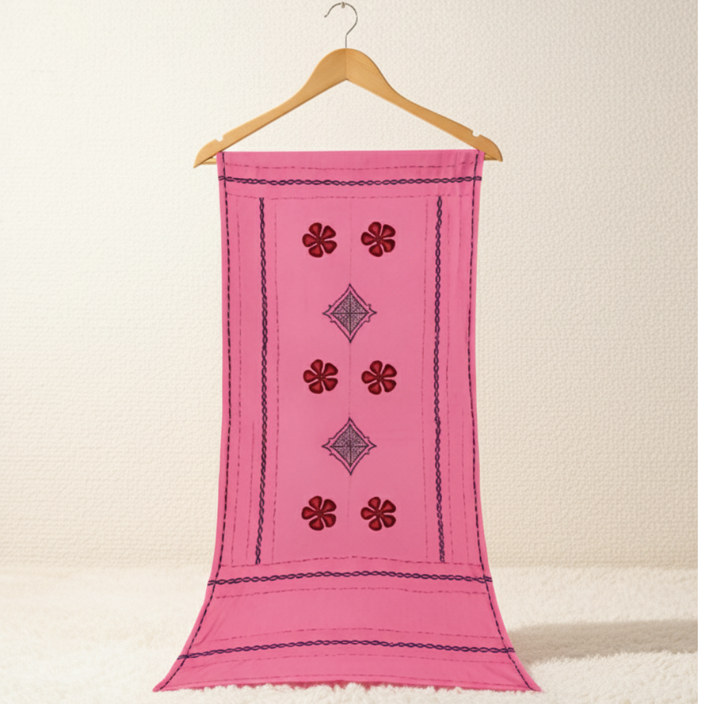 Pink embroidered applique dupatta on a wooden hanger against a beige background