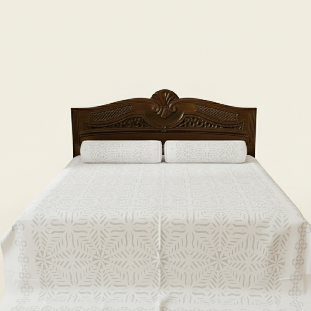 Bed with white quilt and wooden headboard on a beige background