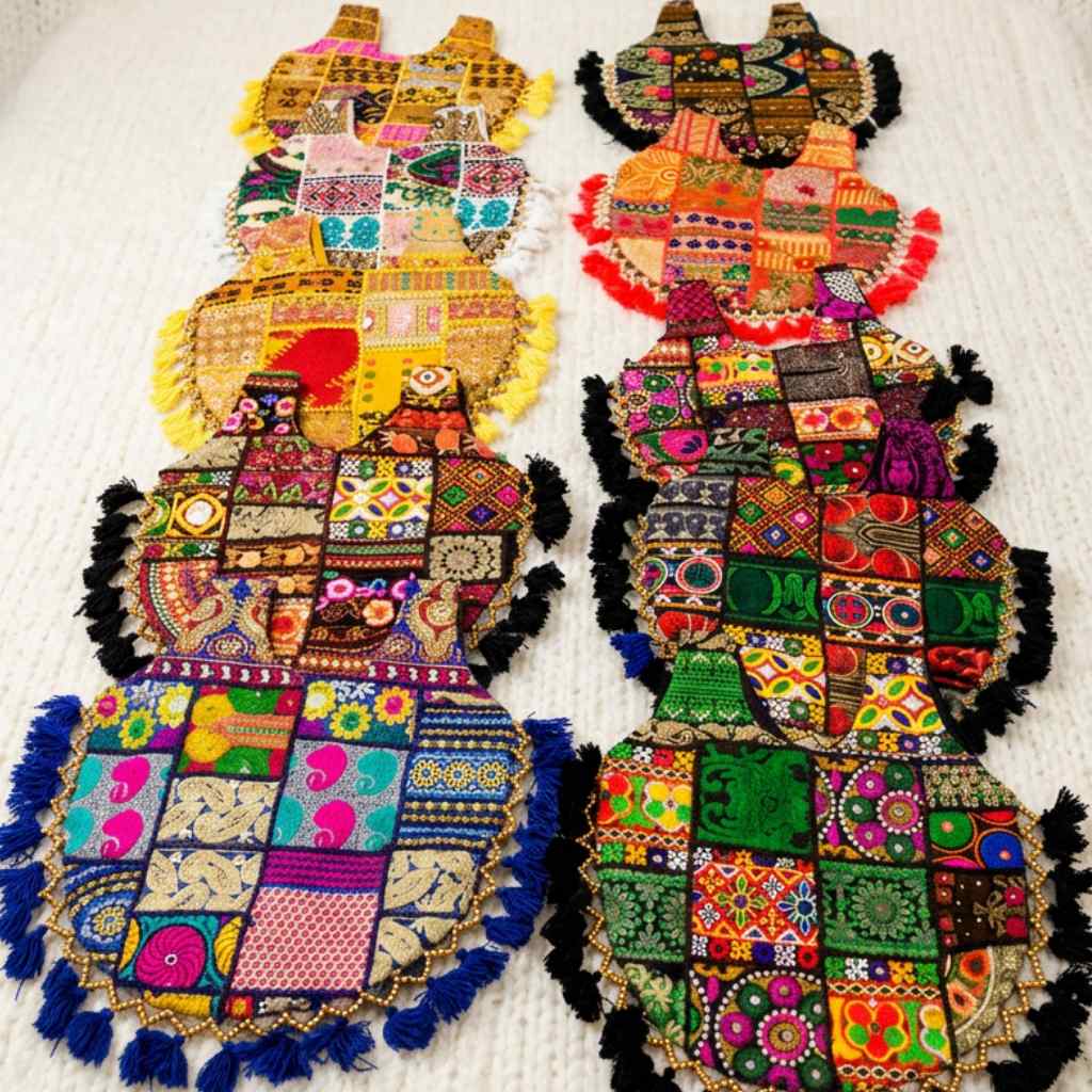 Colorful patchwork boho bags with intricate patterns on a white background