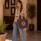 a girl holding a Red Embroidered Rajasthani Bag
