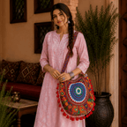 a girl in a pink kurta set with a Rustic Red Embroidered Tote Bag