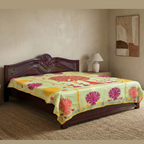 Bedroom with a wooden bed and pastel green tree design applique bedspread